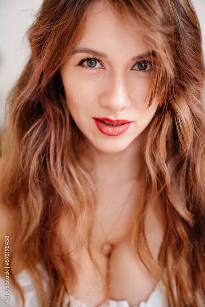 a sexy woman in a romantic top with open shoulders and decollete a sexy woman in a romantic top with open shoulders and decollete