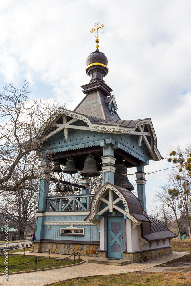 A view of the wooden bell tower of Trinity Monastery of St. Jonas  on the territory of the Botanical Garden in Kyiv. Ukraine 