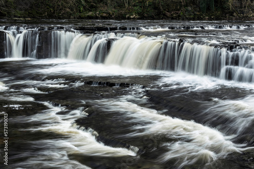 Beautiful dramatic landscape image of Aysgarth Falls in Yorkshire Dales in England during Winter morning