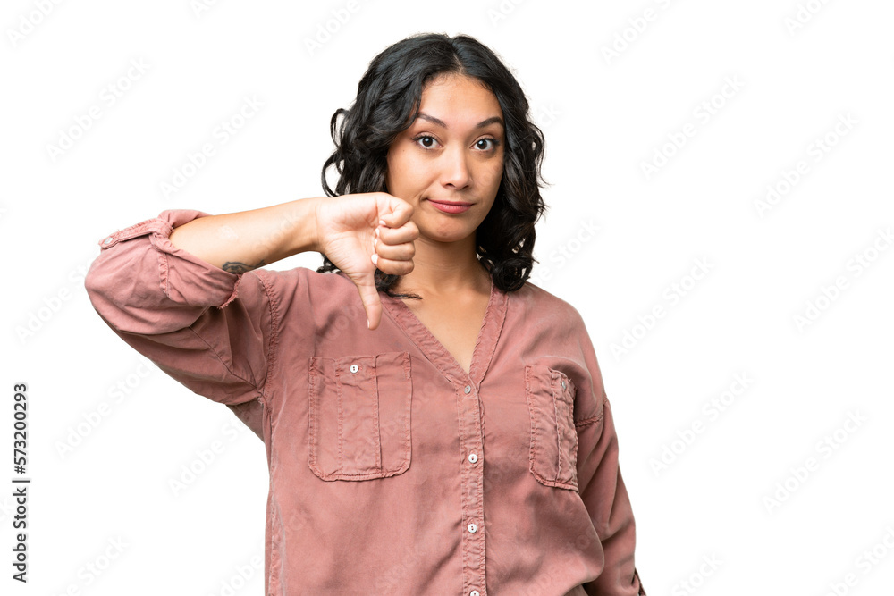 Young Argentinian woman over isolated background showing thumb down with negative expression Young Argentinian woman over isolated background showing thumb down with negative expression