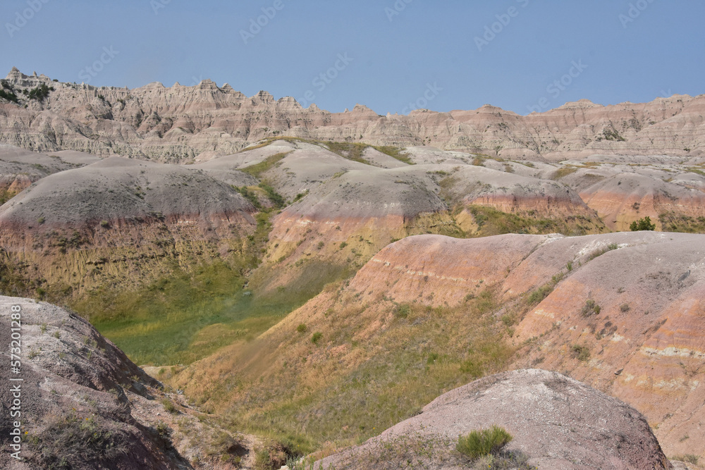 Rugged Badlands Landscape with Yellow Rolling Mounds