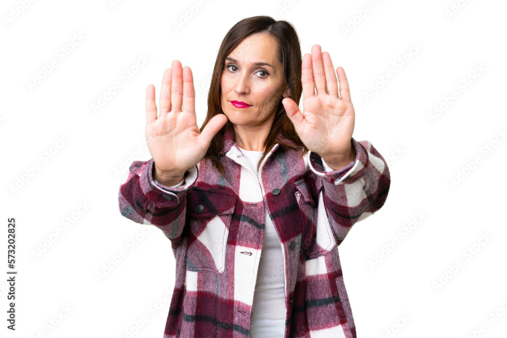 Middle age woman over isolated chroma key background making stop gesture and disappointed Middle age woman over isolated chroma key background making stop gesture and disappointed