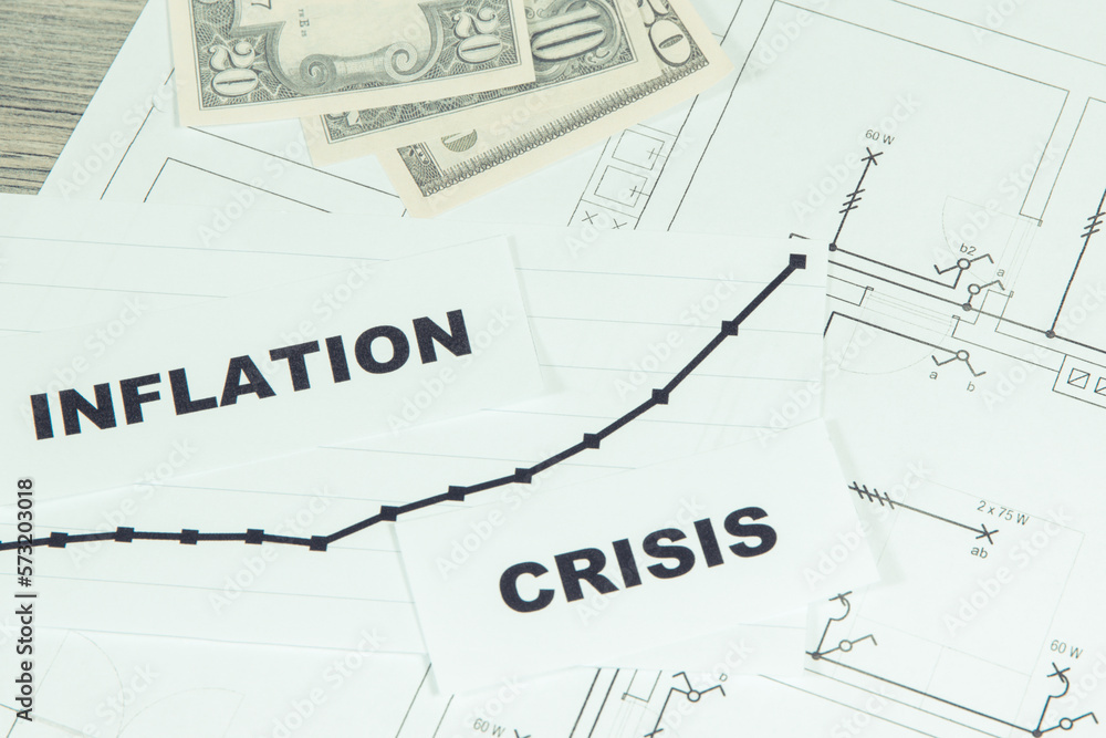 Inscriptions crisis and inflation, currencies Dollar on electrical construction drawing of house. High prices of real estate, building or rent home Inscriptions crisis and inflation, currencies Dollar on electrical construction drawing of house. High prices of real estate, building or rent home