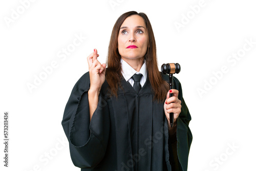 Judge caucasian woman over isolated background with fingers crossing and wishing the best