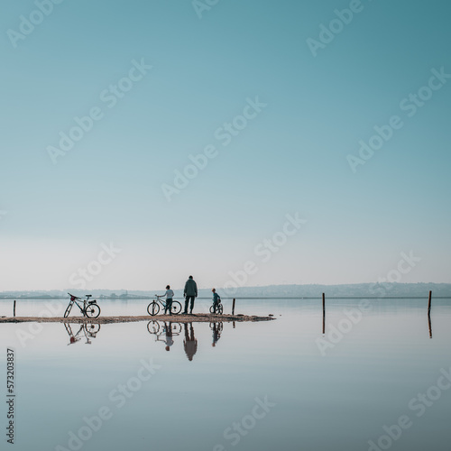 family biking through the pink lagoon