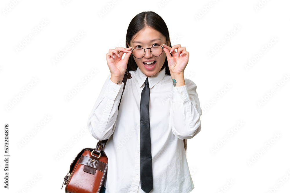 Young Asian business woman over isolated background with glasses and surprised Young Asian business woman over isolated background with glasses and surprised