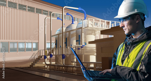 Hydrogen energy production. Man with laptop. Factory worker near tanks H2. Man engineer controls hydrogen synthesis. Tanks for gaseous hydrogen near manufactory. Getting clean electricity from H2