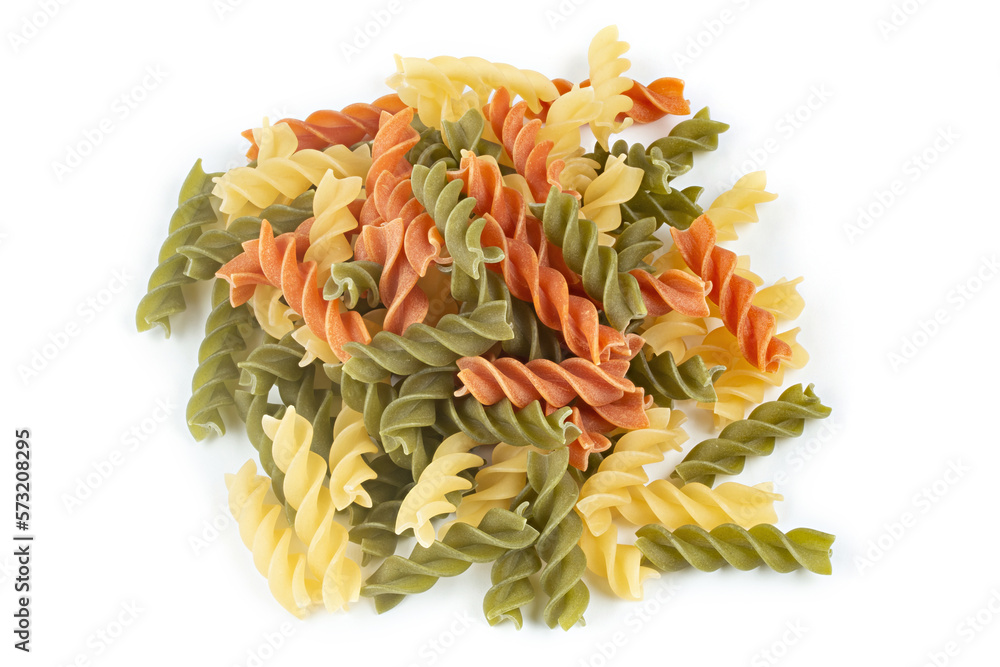 Raw colored pasta fusilli on a white isolated background. Raw colored pasta fusilli on a white isolated background.