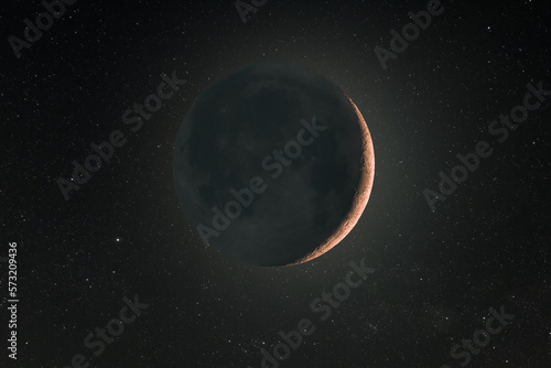 A thin crescent moon with earth shine and background stars