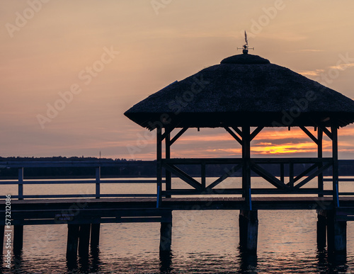 Evening view of tourist pier on Lake Narie in Kretowiny village, Warmia and Mazury region, Poland