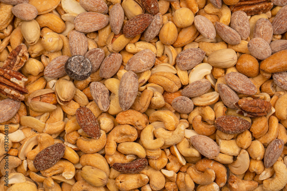 A group of almonds, pistachios, walnuts, macadamia, cashews. A group of almonds, pistachios, walnuts, macadamia, cashews.