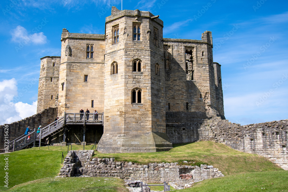 Main keep at Warkworth Castle in Northumberland, UK, against a blue summer sky