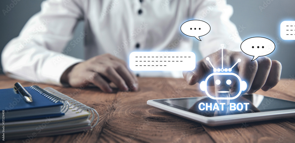 Human using tablet with Chat Bot application for online information. Artificial Intelligence concept Human using tablet with Chat Bot application for online information. Artificial Intelligence concept