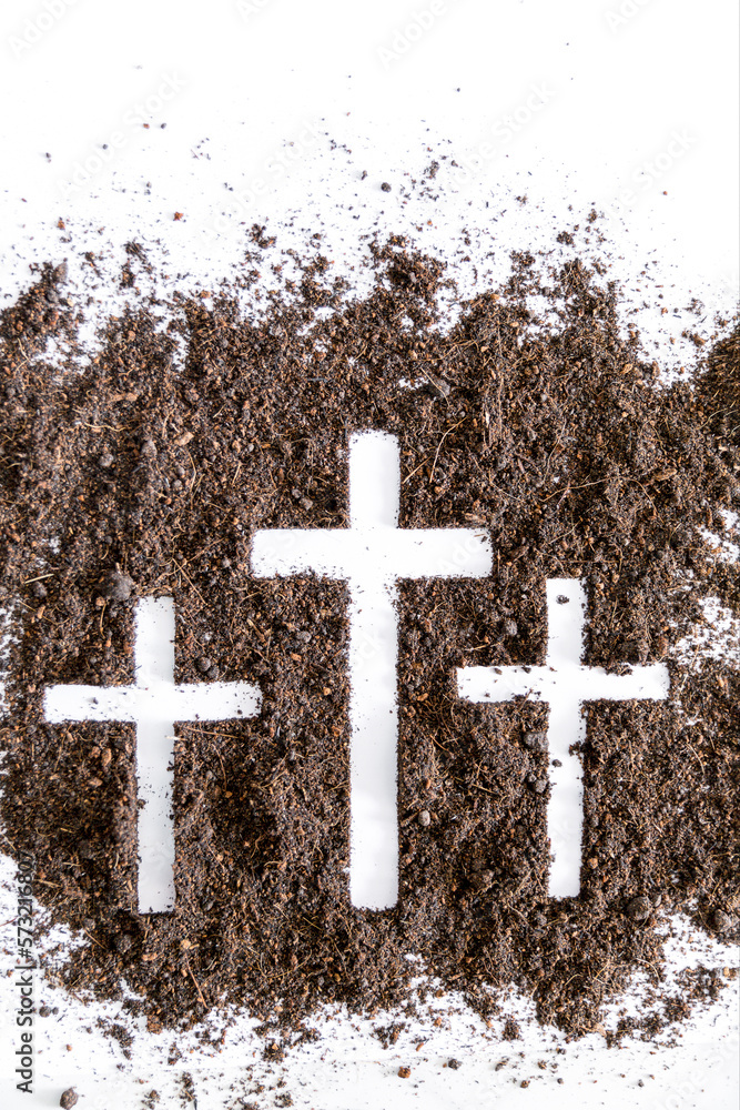 Christian cross or crucifix drawing in ash, dust or sand as symbol of religion, sacrifice, redemption, Jesus Christ, ash wednesday, lent, Good Friday, Easter with Church is devoted to fasting