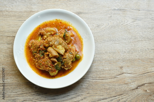 spicy stir fried slice pork leg with eggplant curry on plate