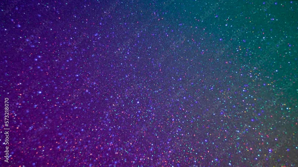 A starry sky with twinkling stars in shades of turquoise and pink. A starry sky with twinkling stars in shades of turquoise and pink.