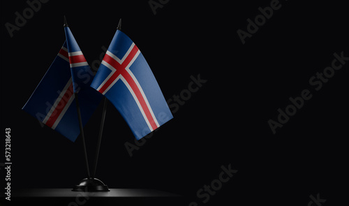 Small national flags of the Iceland on a black background