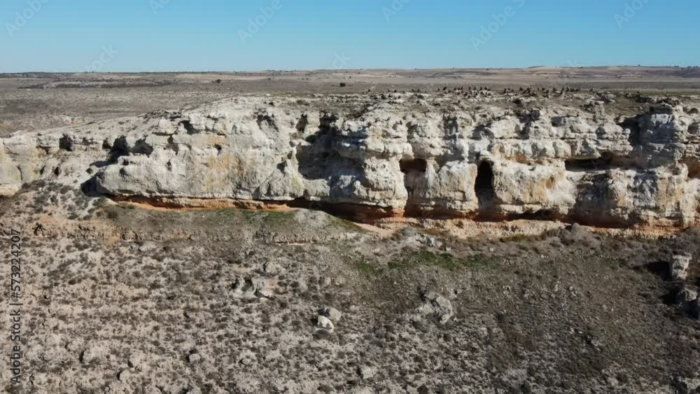 Pelted By Rocks Cliffs of eroded rock and inhabited by a multitude of vultures that ...