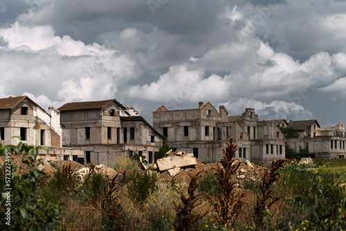 Row of abandoned houses, underdeveloped or ruined. Real estate broken due to earthquakes and other disasters.