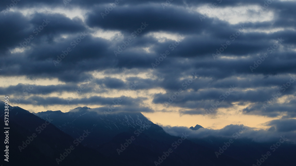Dark clouds over mountains seen from Interlaken, Switzerland.