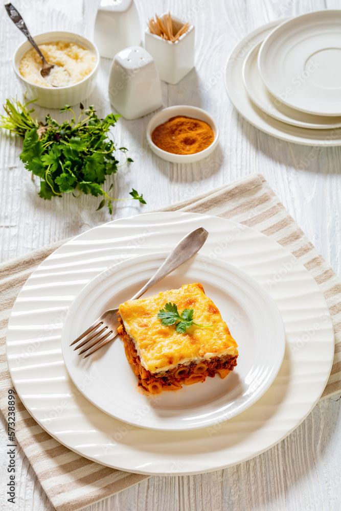 Greek Pastitsio on white plate, top view Greek Pastitsio on white plate, top view