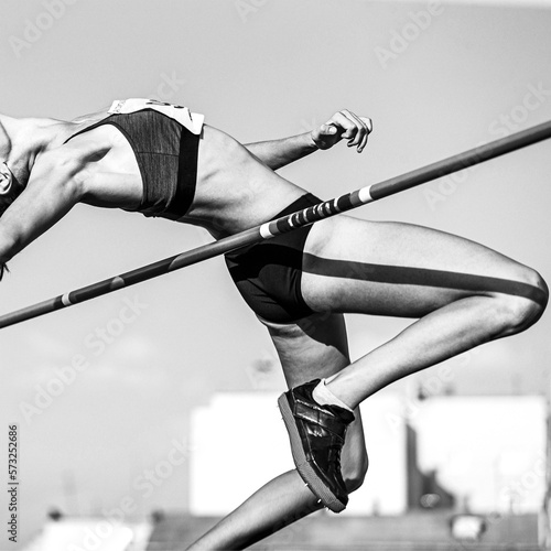 Leinwand Poster high jump in athletics women athlete black and white image