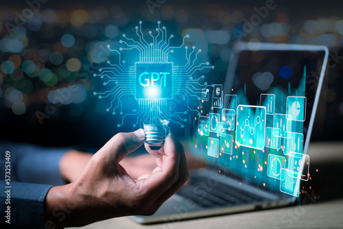 ChatGPT Chat with AI or Artificial Intelligence. Young businessman chatting with a smart AI or artificial intelligence using an artificial intelligence chatbot developed by OpenAI.