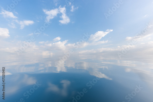 Blue sky, white clouds, and sea surface
