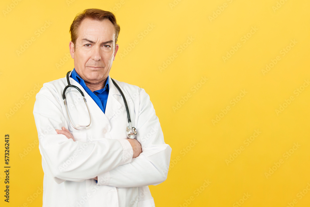 Serious doctor looking at the camera with arms crossed Serious doctor looking at the camera with arms crossed
