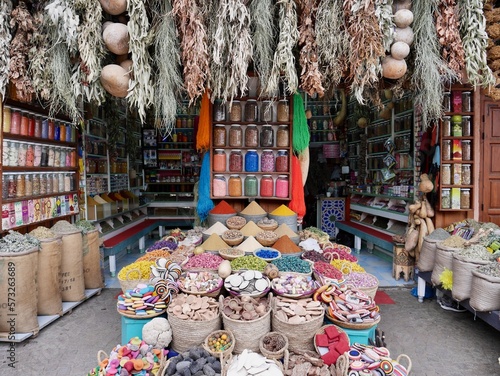 Beautifully arranged herbs and spices in barrels and baskets in the souk of Marrakech, Morocco.