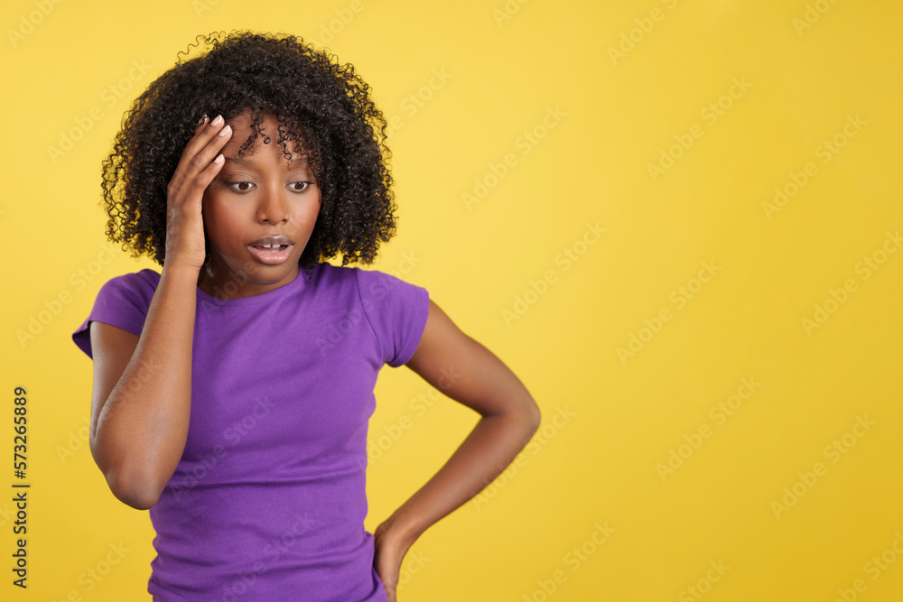 Woman with afro hair gesturing that she is forgetting something