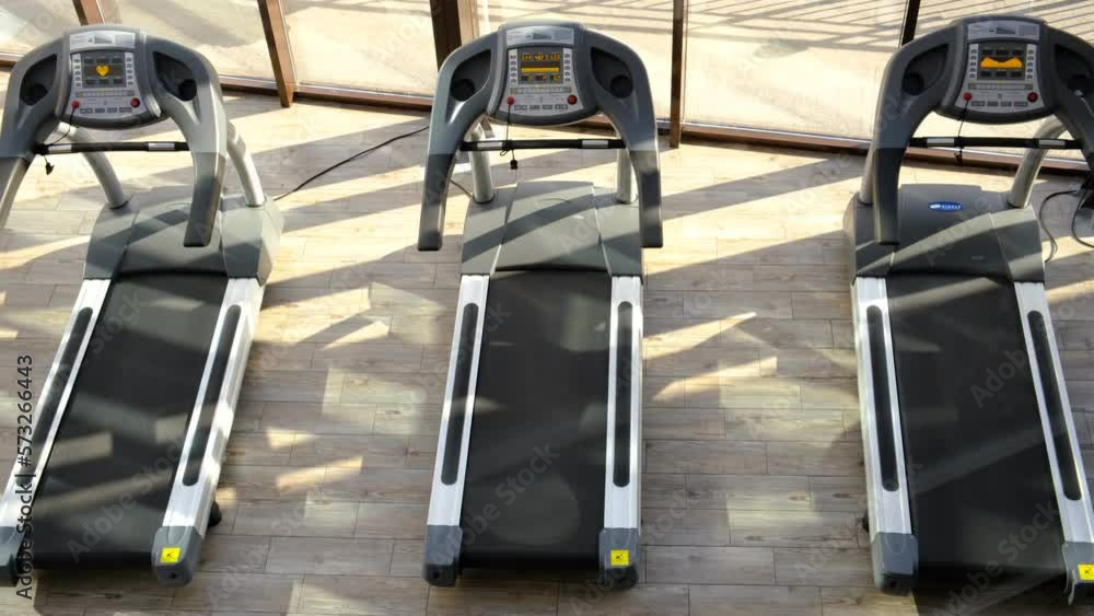 Treadmills in the gym. Cardio workout for weight loss. Running for endurance. Doing sports on the equipment in the hall Treadmills in the gym. Cardio workout for weight loss. Running for endurance. Doing sports on the equipment in the hall