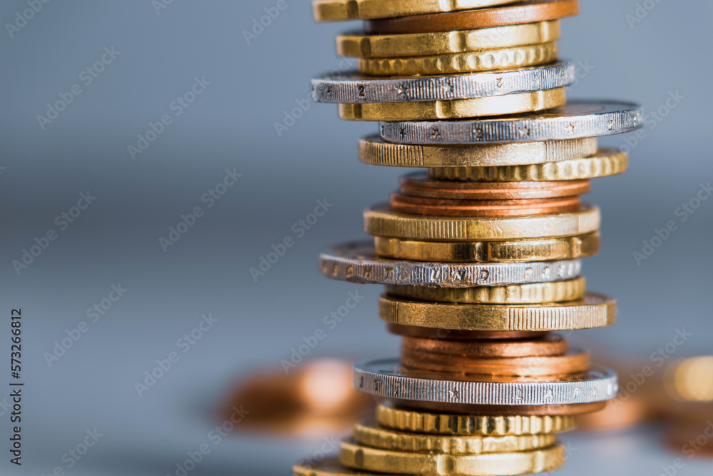 Euro coins stacked in a pile with a blurred background Euro coins stacked in a pile with a blurred background