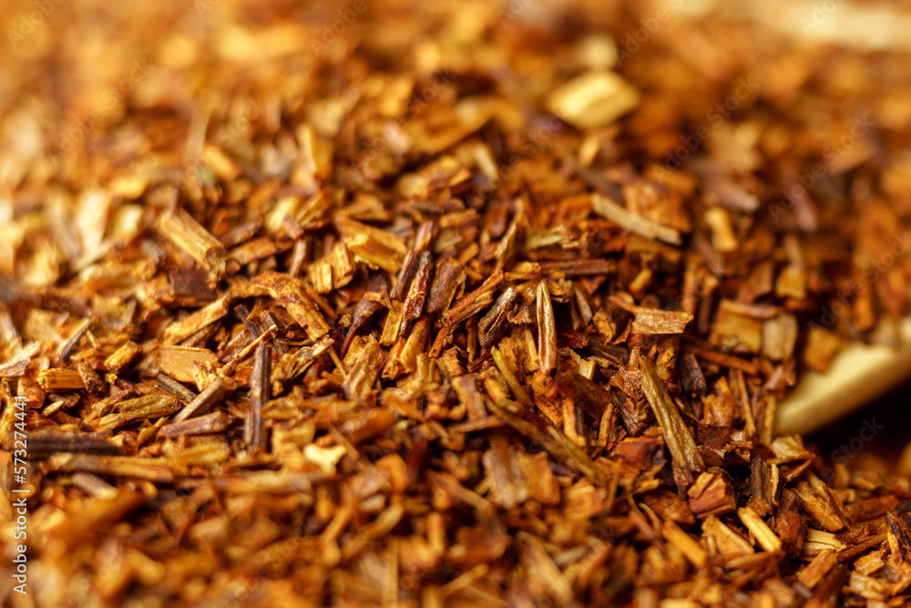 Tea drink rooibos made from the leaves, stems and flowers of a South African plant. Selective focus Tea drink rooibos made from the leaves, stems and flowers of a South African plant. Selective focus
