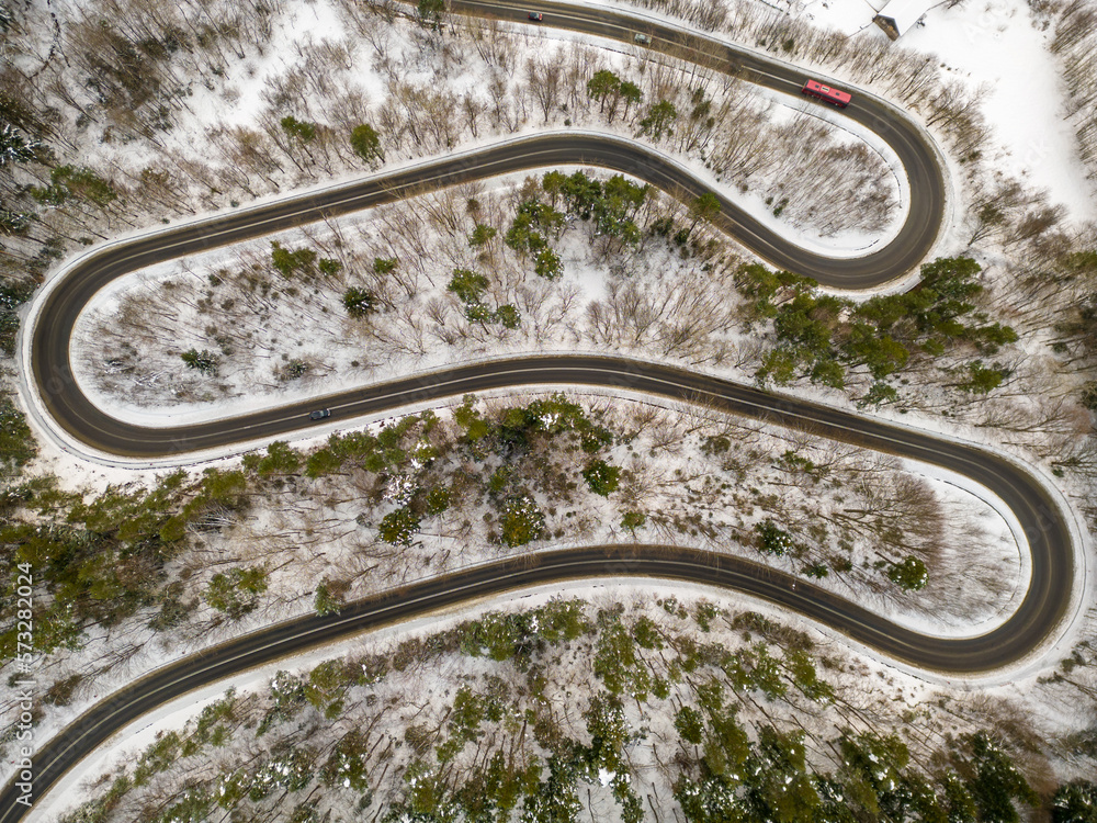 View of mountain serpentines on a national road in a winter snow scenery, Korzeniec, Subcarpathian, Poland  