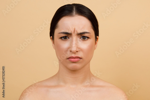 Glabellar Lines. Unhappy Young Indian Woman Frowning While Looking At Camera