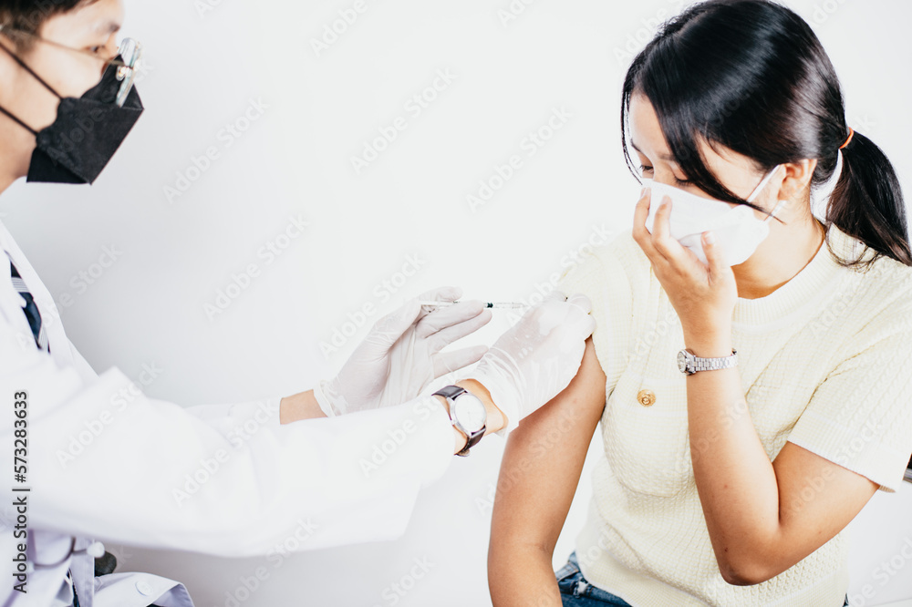 Doctor in medical gloves giving of flu patients Doctor in medical gloves giving of flu patients