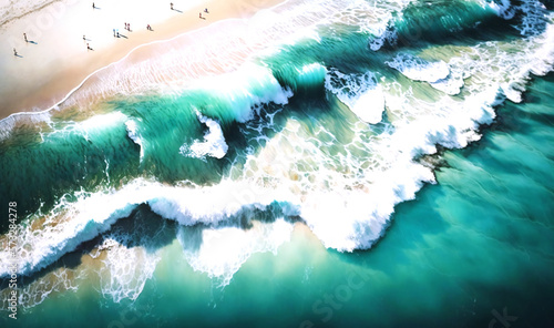 Aerial shot of a beach with surfers catching waves © Nilima