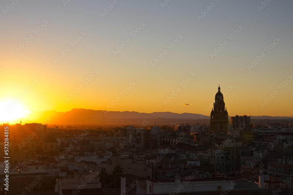 Sunset in Murcia with the cathedral tower in the background Sunset in Murcia with the cathedral tower in the background