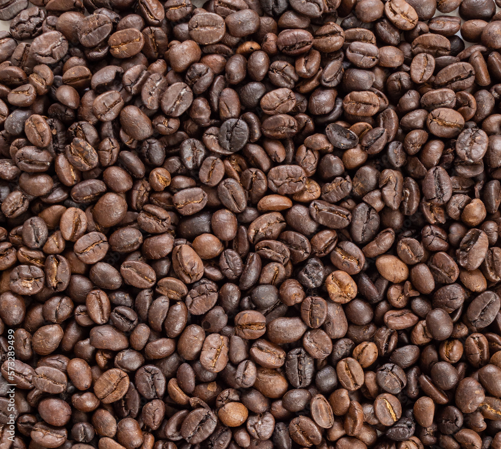 Fresh roasted brown coffee beans background Fresh roasted brown coffee beans background