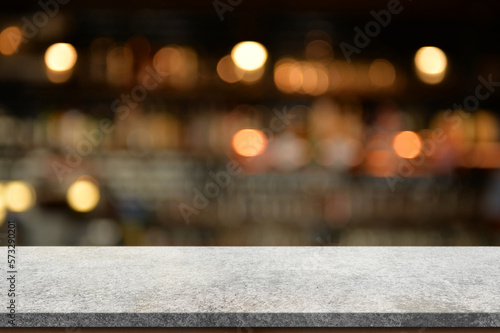 Empty white marble stone table top and blur interior cafe and restaurant. 