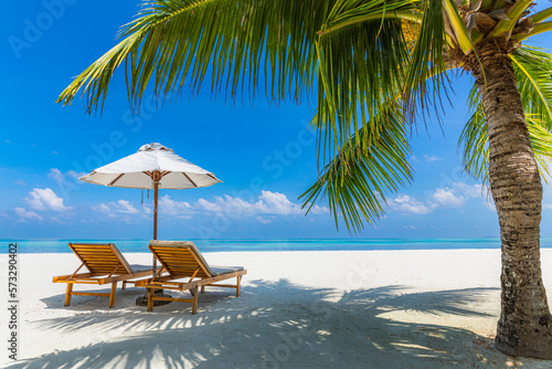Fototapeta Naklejka Na Ścianę i Meble -  Amazing beach. Chairs on the sandy beach sea. Luxury summer holiday and vacation resort hotel for tourism. Inspirational tropical landscape. Tranquil scenery, relax beach, beautiful landscape design
