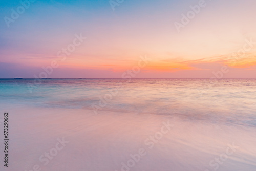 Fototapeta Naklejka Na Ścianę i Meble -  Closeup sea sand beach. Long exposure beach landscape. Inspire tropical beach seascape horizon. Dream colorful sunset sky. Calming tranquil meditation sunlight. Beautiful orange coast wave water