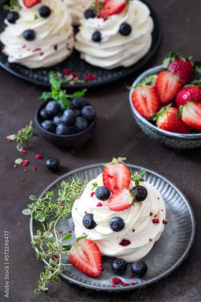 Mini pavlova meringue cake with whipped cream and fresh berries. Mini pavlova meringue cake with whipped cream and fresh berries.
