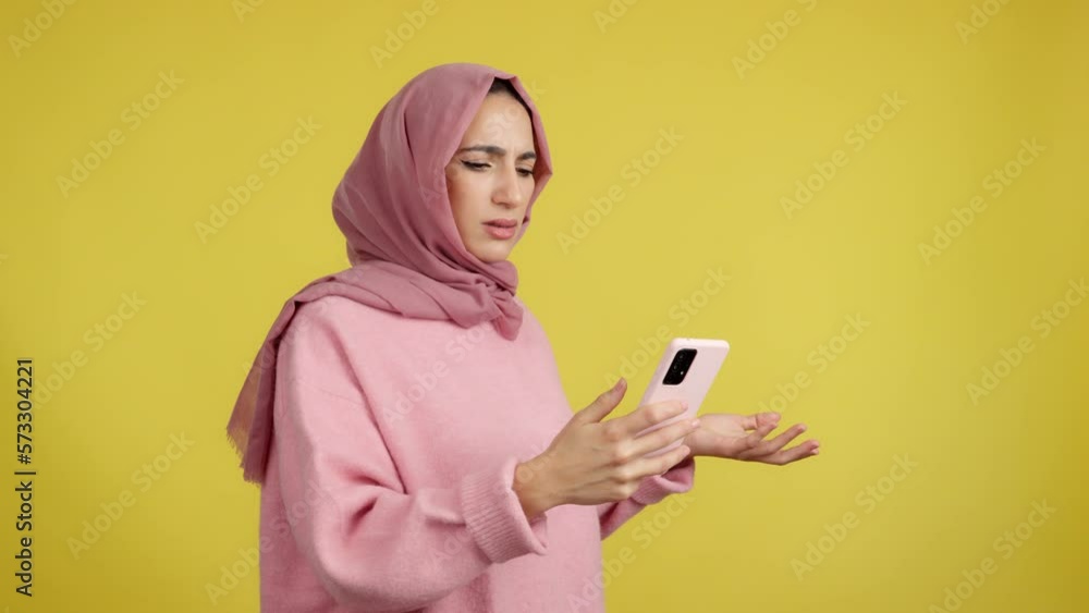 Worried muslim woman using a mobile phone Worried muslim woman using a mobile phone