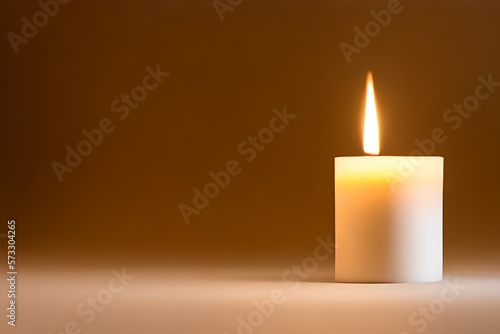 An isolated white candle on dark background and negative space. Aromatherapy candle.