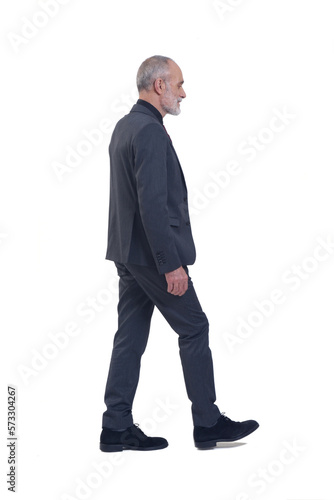side and back view of a man with suit and tie walking on white background