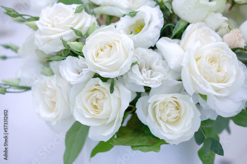 bouquet of white roses on the wedding table