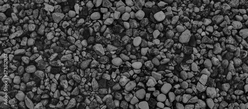 Black and white background from the texture of stones. Pebble banner