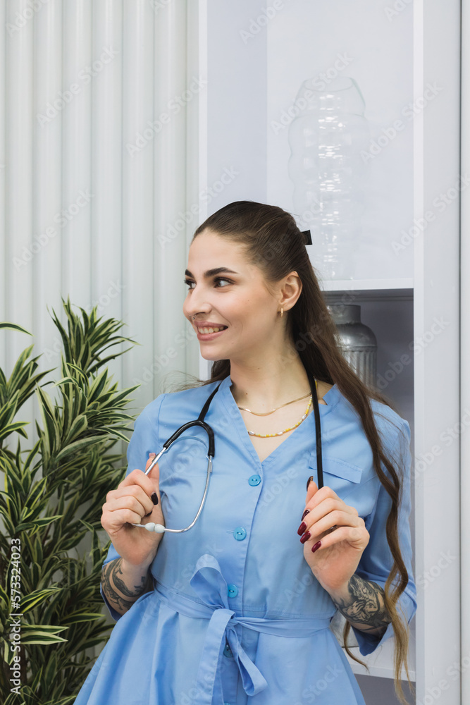 The cosmetic dermatologist is standing with a warm and welcoming smile, putting patients at ease and creating a comfortable atmosphere in her workspace. The cosmetic dermatologist is standing with a warm and welcoming smile, putting patients at ease and creating a comfortable atmosphere in her workspace.